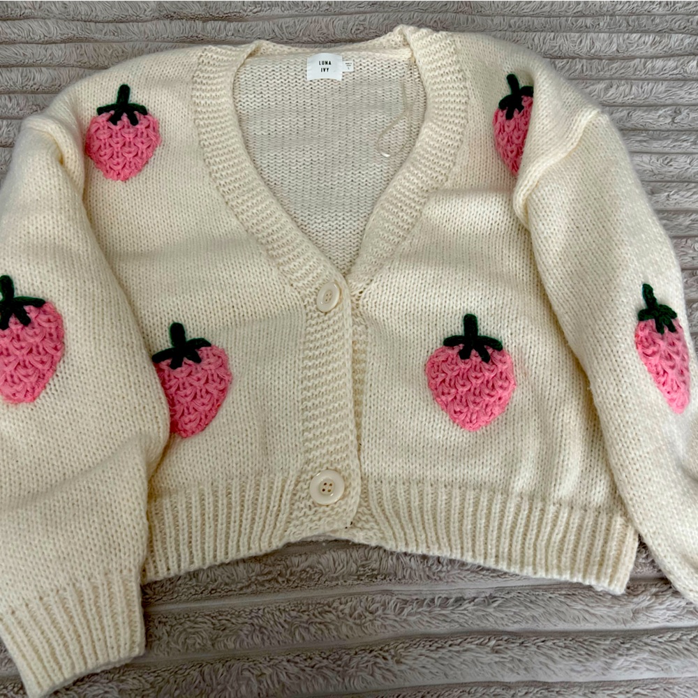 Strawberry knit sweater . Size large. Beige color